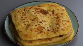 বাদামের পুরে তৈরি করুন মজার ঘি-পরোটা