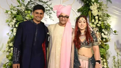 পরে নূপুর পরে বিয়ের পোশাকও। পাশে শ্বশুর আমির ও স্ত্রী ইরা। ছবি: সংগৃহীত